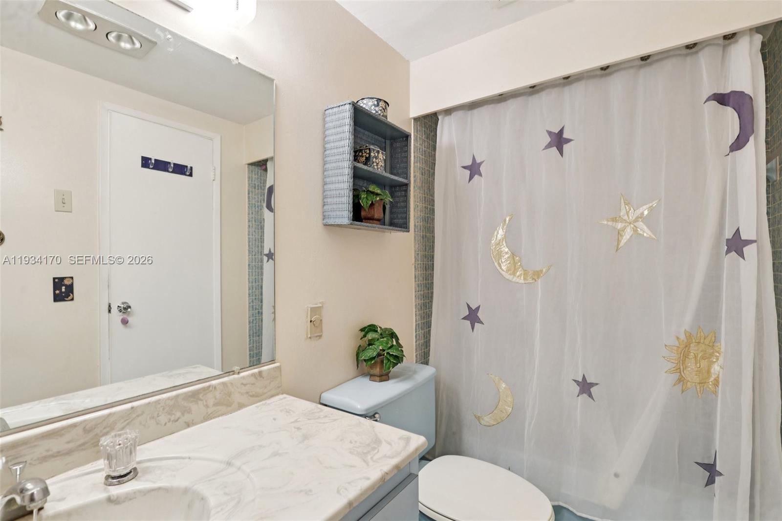 4350 Hillcrest Drive, Unit 702 Hollywood, FL 33021 - Photo 20 of 29 a bathroom with a sink toilet and shower