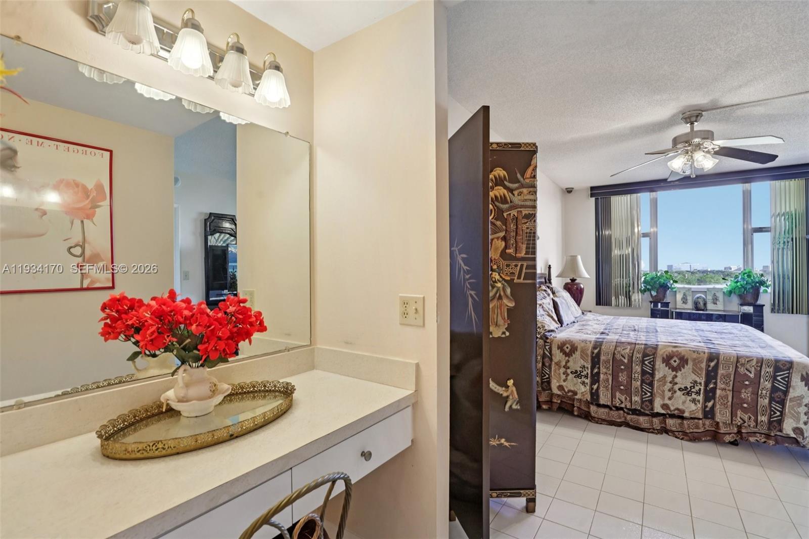 4350 Hillcrest Drive, Unit 702 Hollywood, FL 33021 - Photo 21 of 29 a living room with furniture and a chandelier