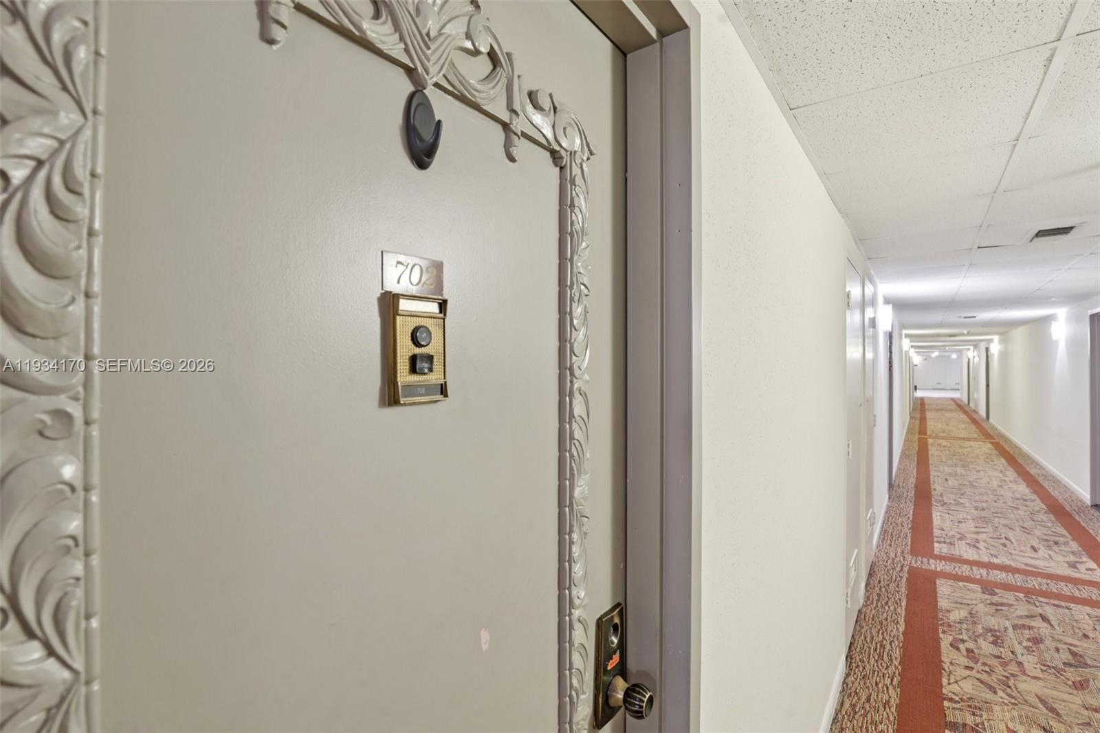 4350 Hillcrest Drive, Unit 702 Hollywood, FL 33021 - Photo 27 of 29 a view of a hallway with windows