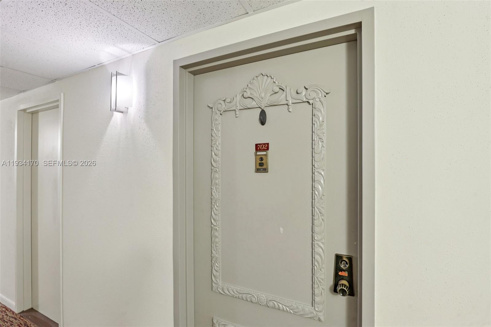 4350 Hillcrest Drive, Unit 702 Hollywood, FL 33021 - Photo 28 of 29 a bathroom with a shower and a mirror