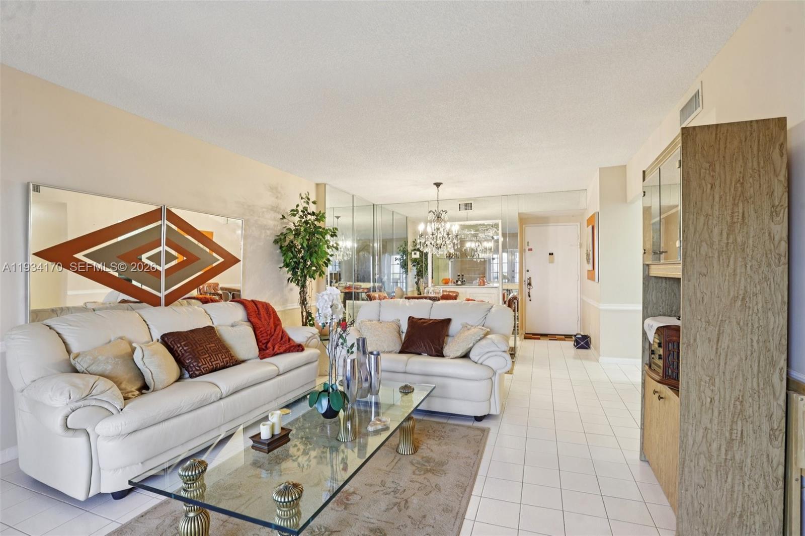 4350 Hillcrest Drive, Unit 702 Hollywood, FL 33021 - Photo 4 of 29 a living room with furniture and a rug