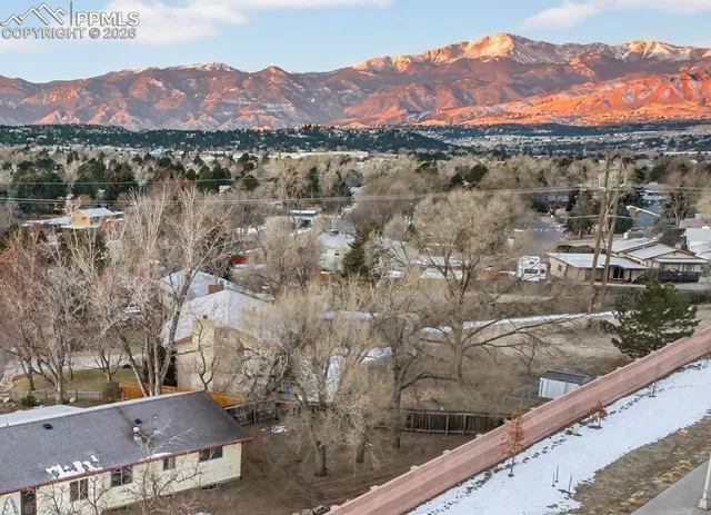 a picture of a bench in front of a window