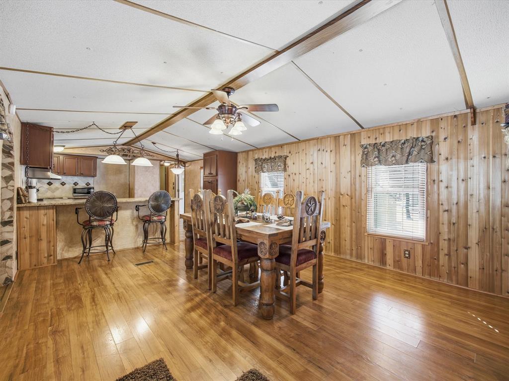 196 Perch Road Bowie, TX 76230 - Photo 3 of 33 a view of a dining room with furniture window and wooden floor