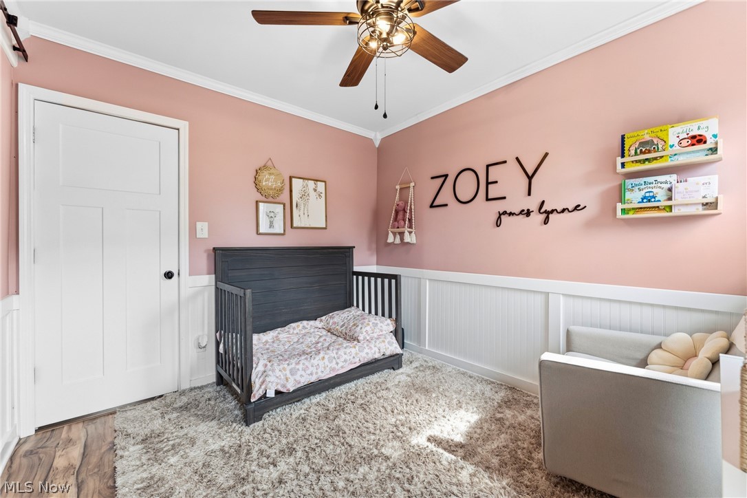 258 Randolph Road Mogadore, OH 44260 - Photo 20 of 49 Interior room featuring a ceiling fan with integrated lighting, wood-finish flooring, and white baseboards
