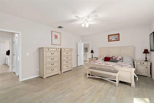a bedroom with furniture and a chandelier