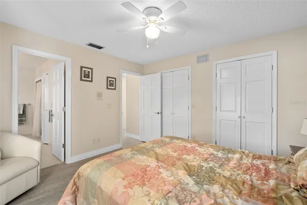 a bedroom with a bed and a couch