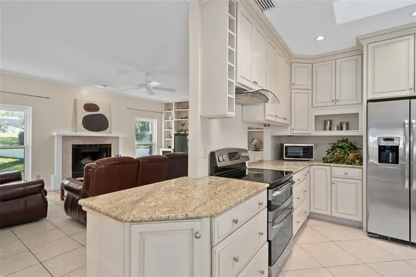 a kitchen with a stove a sink and a refrigerator
