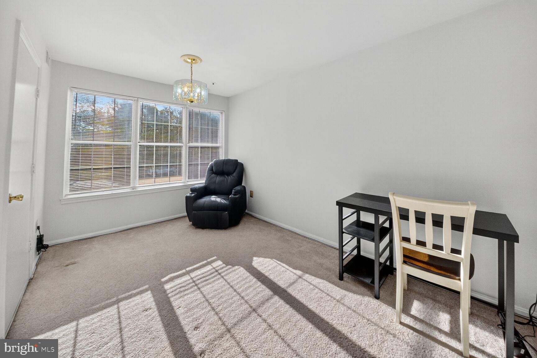 14901 McKisson Court, Unit 7CC Silver Spring, MD 20906 - Photo 5 of 34 a bedroom with furniture and a window
