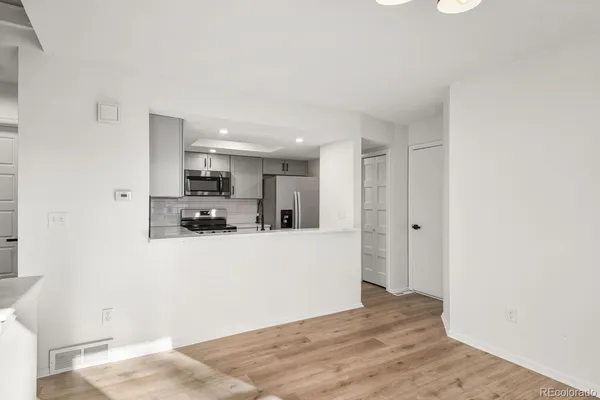 a view of kitchen with wooden floor