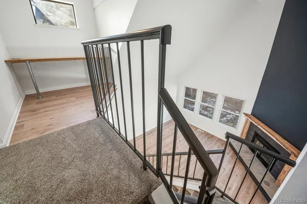 a view of a hallway with seating area