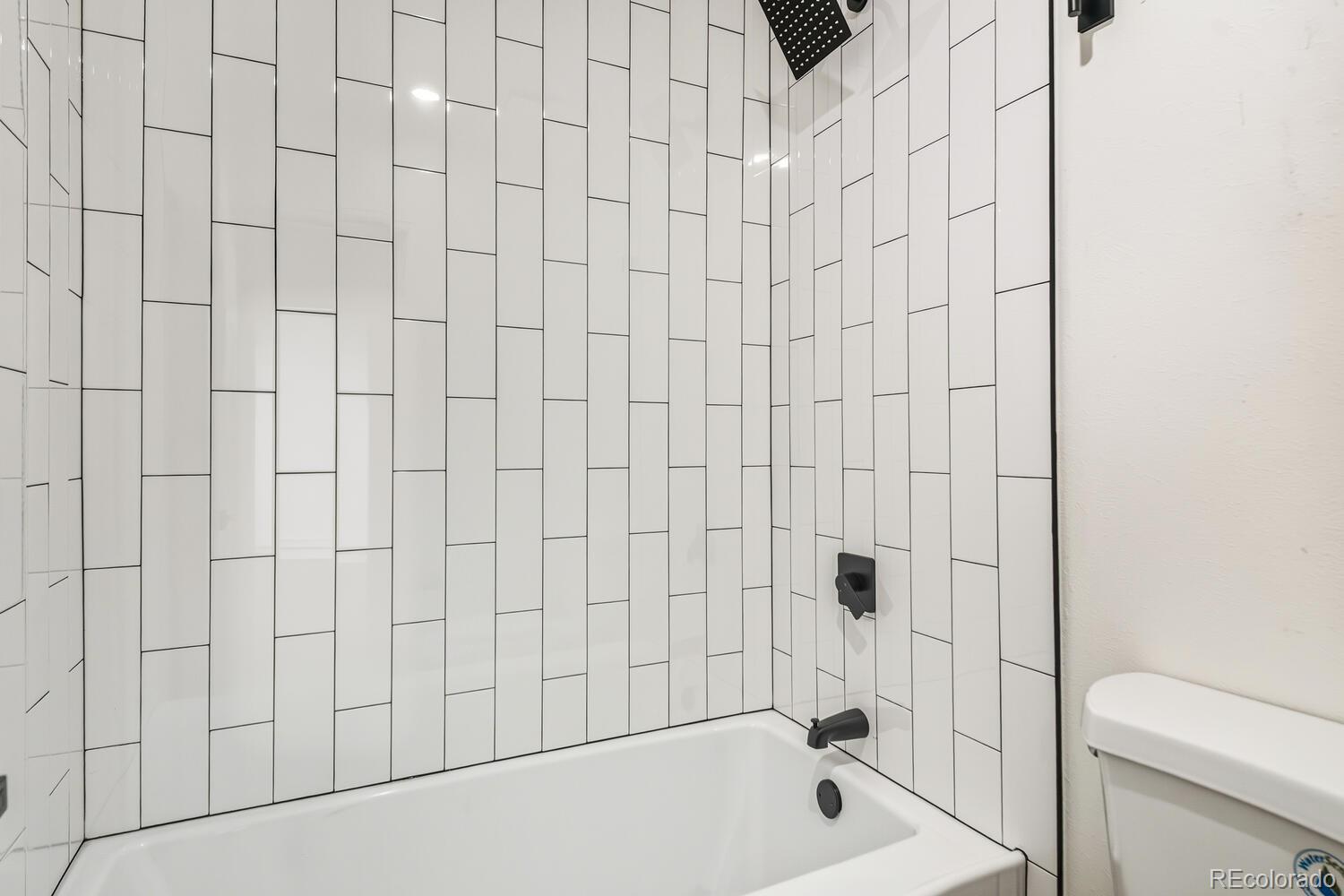9041 Zephyr Court Broomfield, CO 80021 - Photo 27 of 35 a bathroom with a bathtub