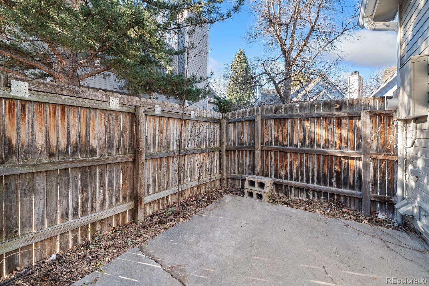 9041 Zephyr Court Broomfield, CO 80021 - Photo 31 of 35 a view of wooden fence with a small yard