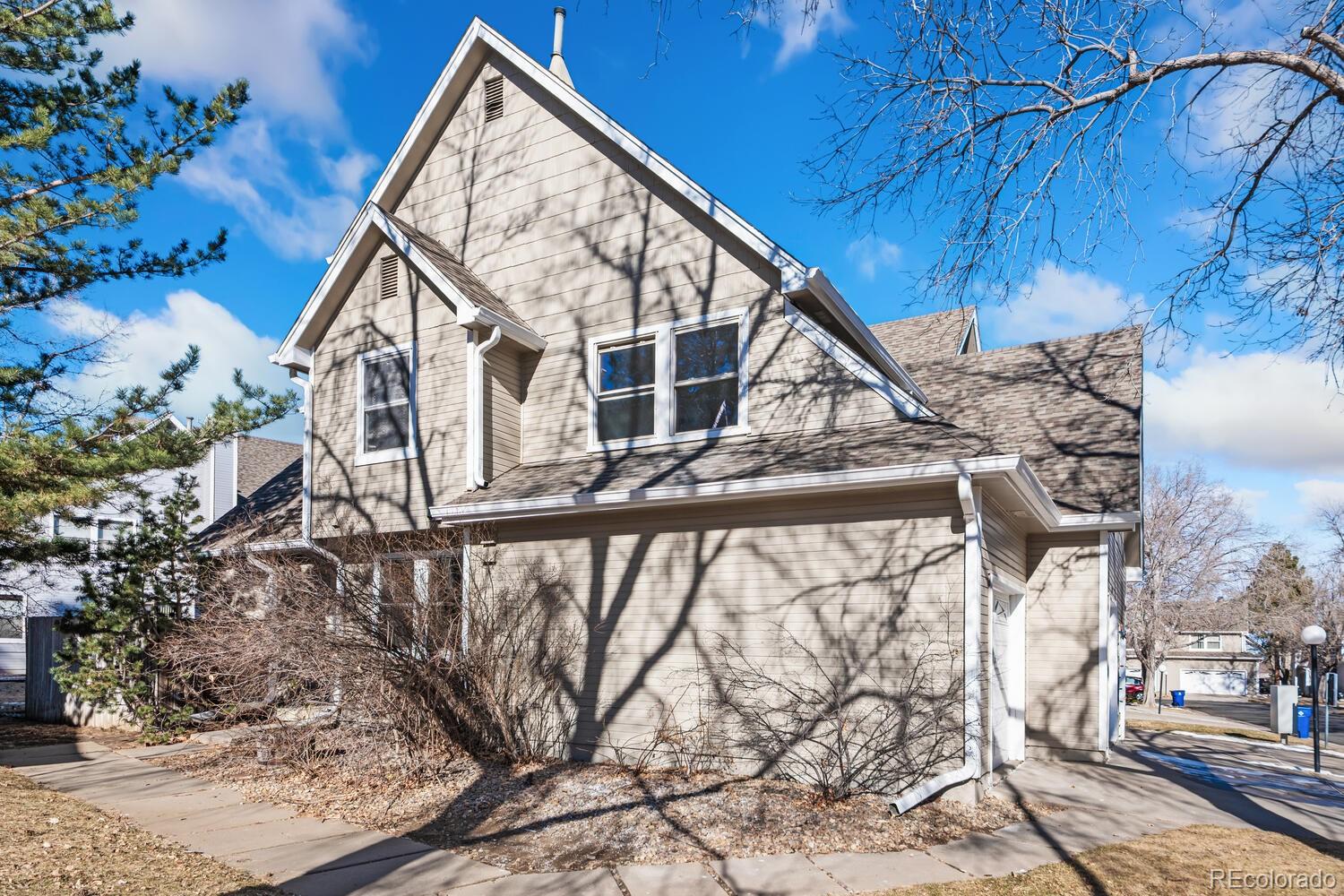 9041 Zephyr Court Broomfield, CO 80021 - Photo 34 of 35 a view of a house with a yard from a balcony