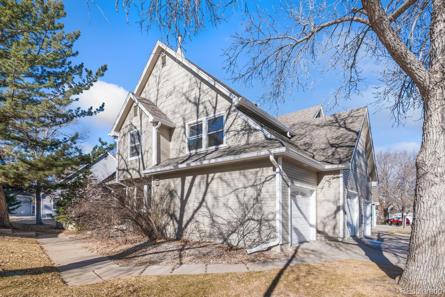 9041 Zephyr Court Broomfield, CO 80021 - Photo 35 of 35 a view of a house with a yard