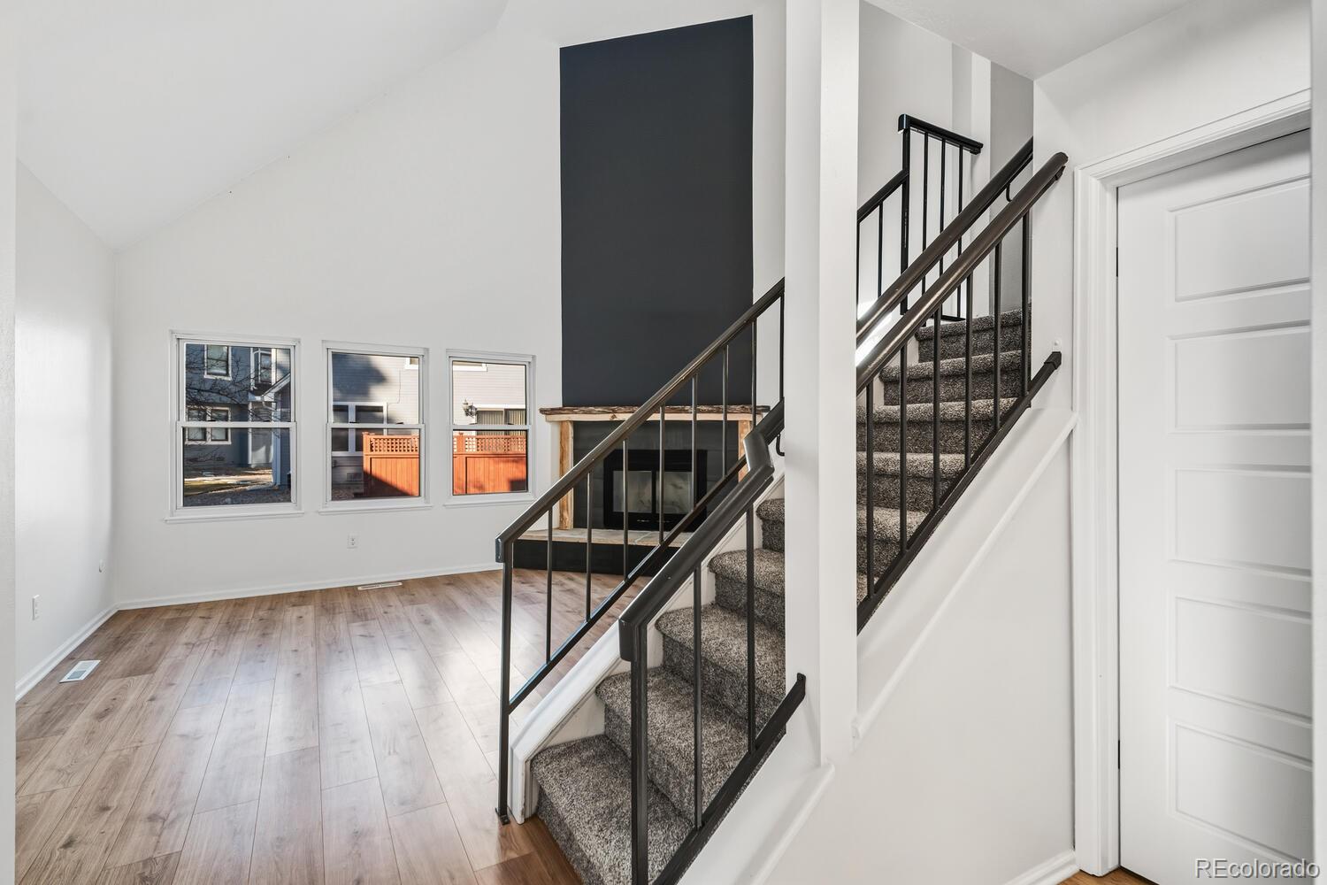 9041 Zephyr Court Broomfield, CO 80021 - Photo 7 of 35 a view of entryway and hall with wooden floor