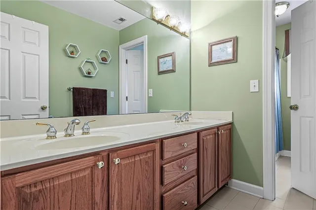 a kitchen with stainless steel appliances granite countertop a sink a stove and cabinets