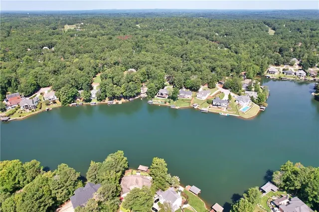 an aerial view of a house with a lake view