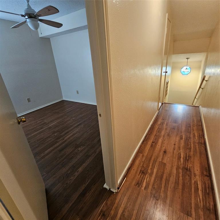 4951 Regal Bluff Mesquite, TX 75150 - Photo 8 of 11 a view of an empty room and wooden floor