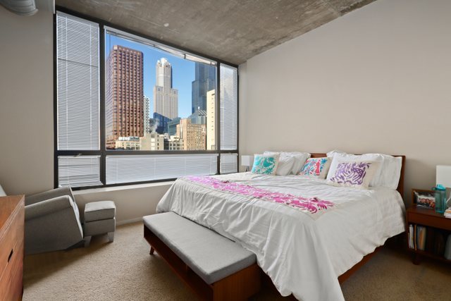520 South State Street, Unit 711 Chicago, IL 60605 - Photo 15 of 28 a bedroom with a bed and large window