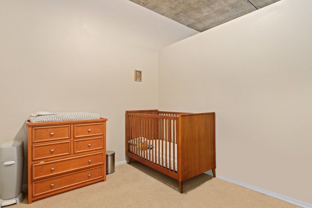 520 South State Street, Unit 711 Chicago, IL 60605 - Photo 19 of 28 a view of a dresser with wooden floor
