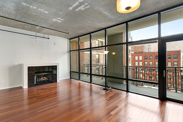 520 South State Street, Unit 711 Chicago, IL 60605 - Photo 3 of 28 a view of an empty room with wooden floor and a window