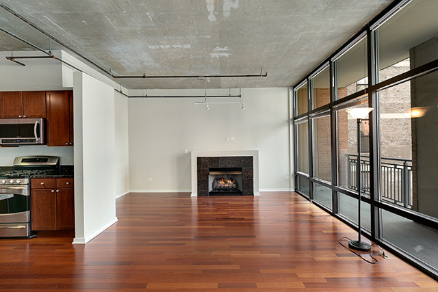 520 South State Street, Unit 711 Chicago, IL 60605 - Photo 5 of 28 a view of a livingroom with wooden floor a fireplace