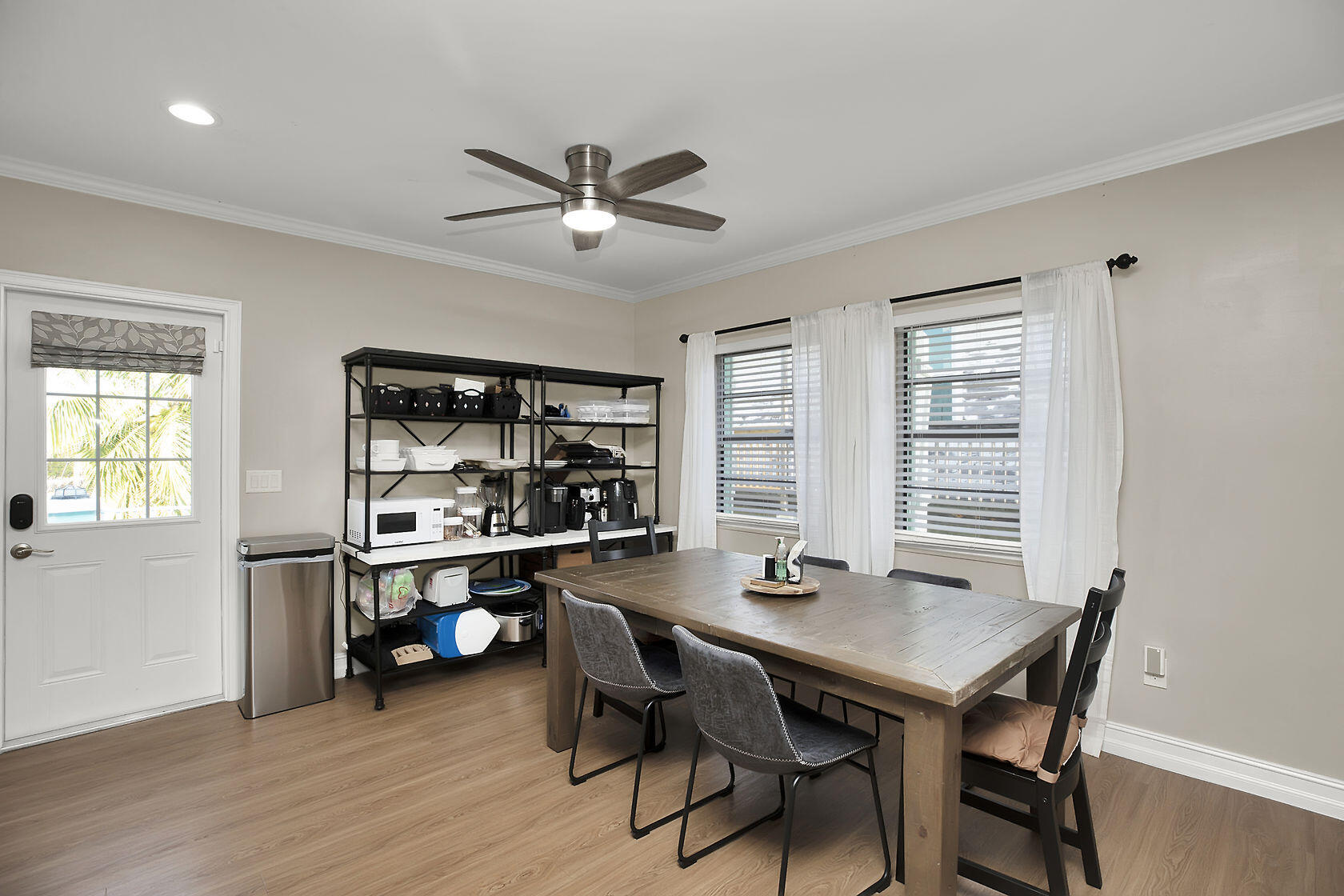 1632 Bogie Drive Big Pine Key, FL 33043 - Photo 13 of 47 a view of a dining room with furniture window and wooden floor