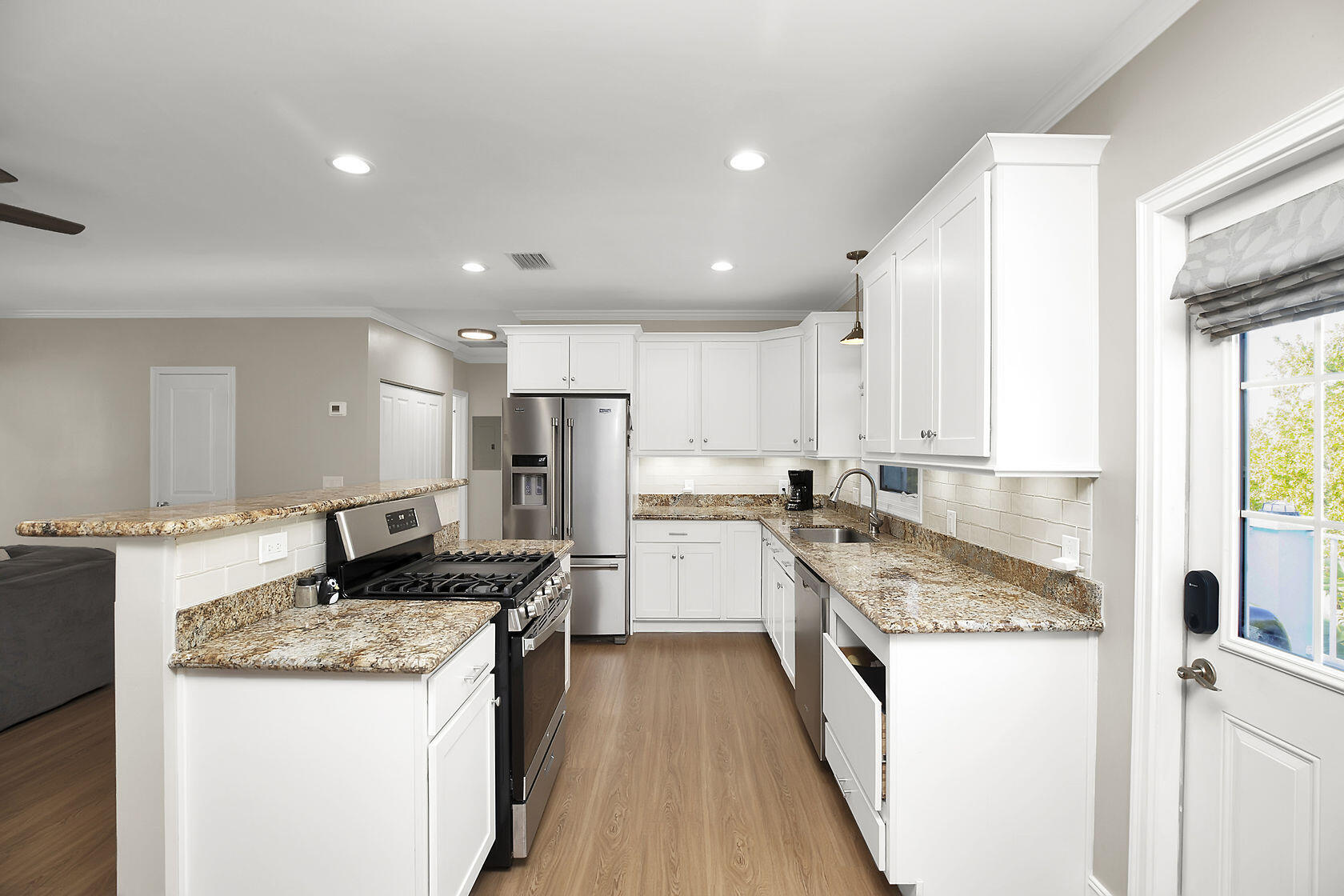 1632 Bogie Drive Big Pine Key, FL 33043 - Photo 15 of 47 a kitchen with stainless steel appliances granite countertop a sink stove and refrigerator