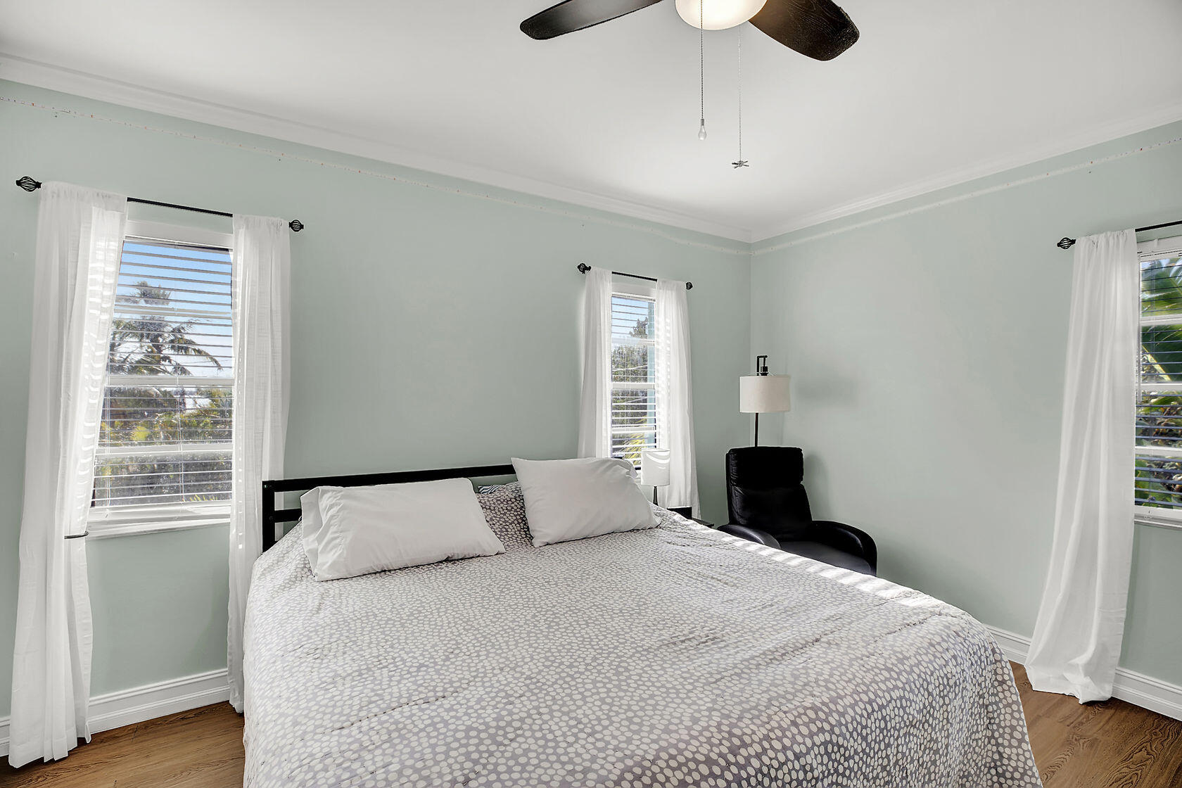 1632 Bogie Drive Big Pine Key, FL 33043 - Photo 19 of 47 a bedroom with a bed and wooden floor