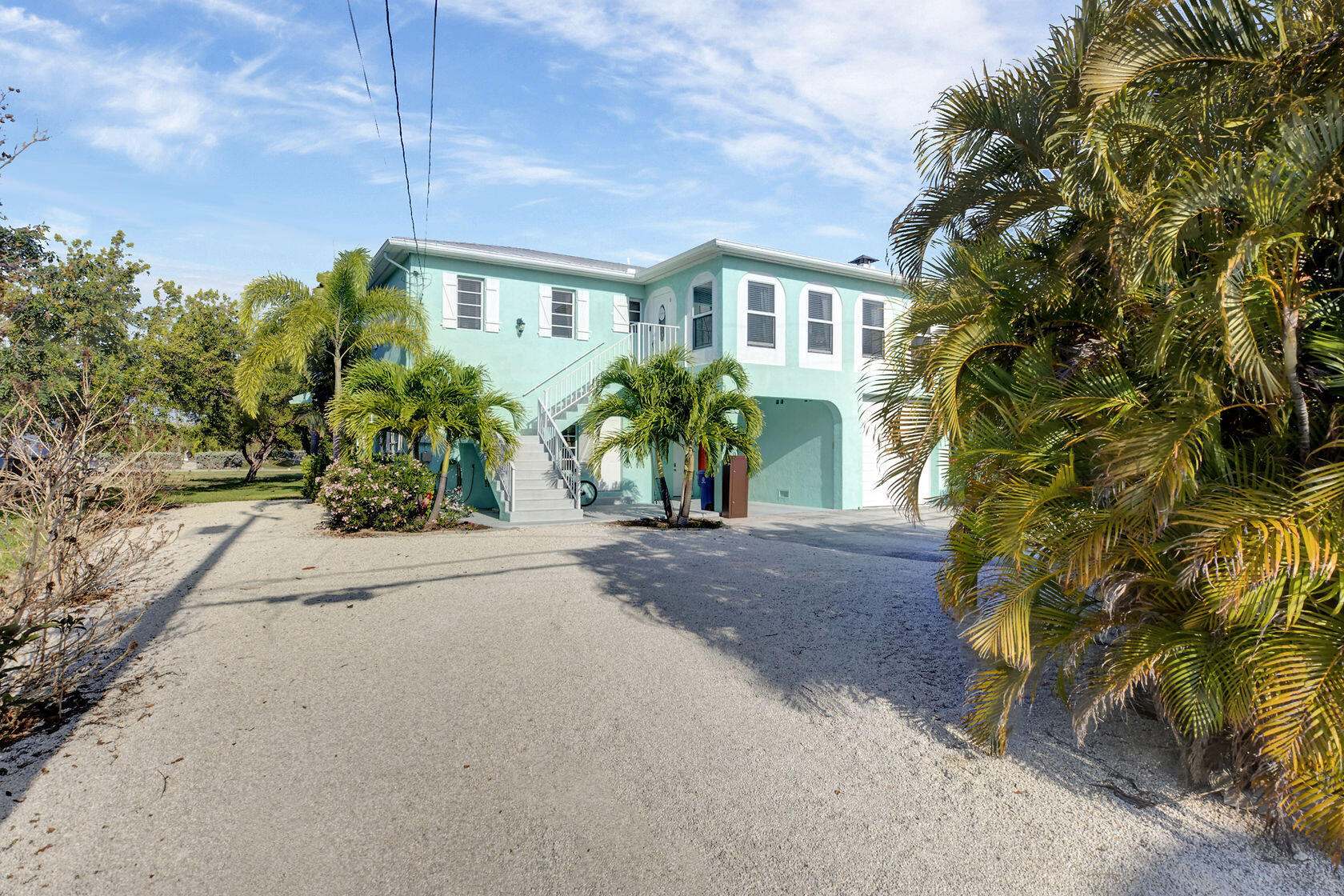 1632 Bogie Drive Big Pine Key, FL 33043 - Photo 2 of 47 front view of a house with a yard