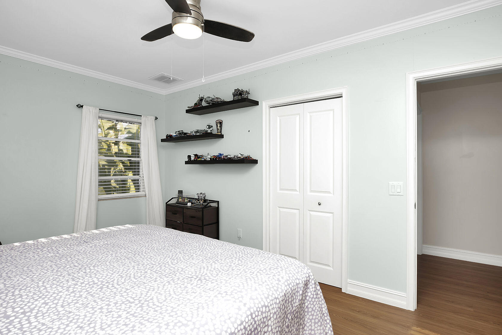 1632 Bogie Drive Big Pine Key, FL 33043 - Photo 23 of 47 a bedroom with a bed and wooden floor