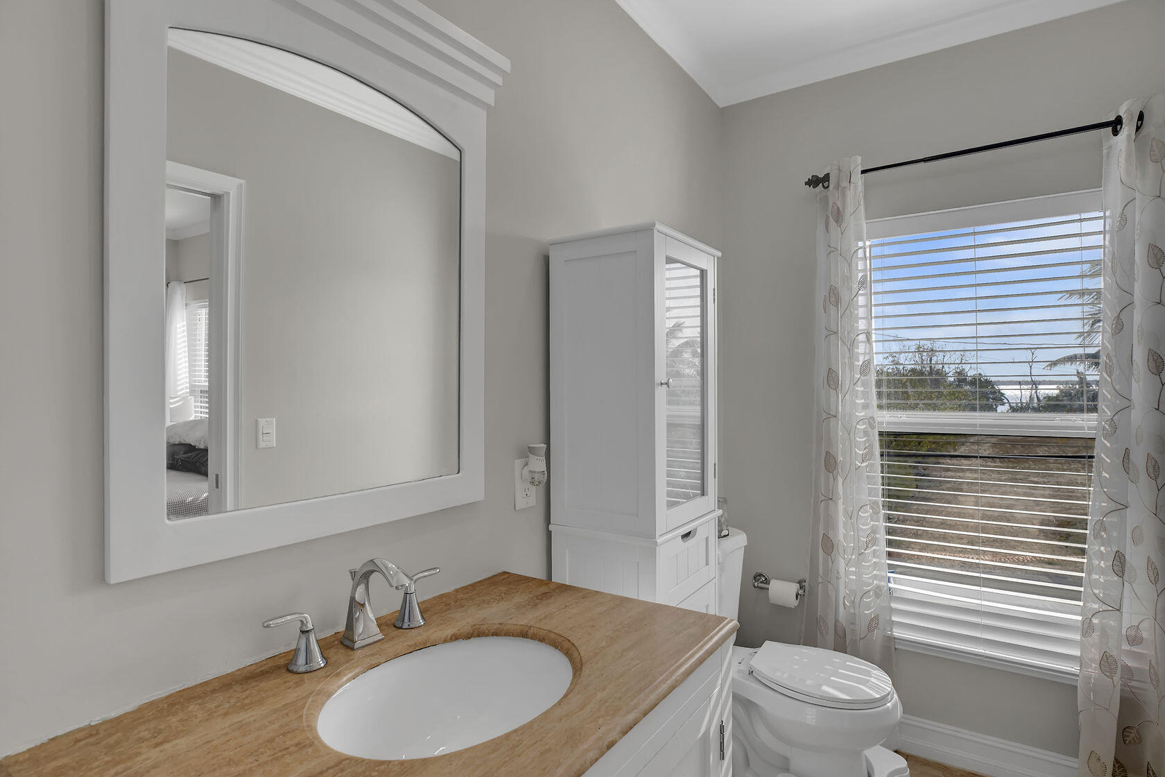 1632 Bogie Drive Big Pine Key, FL 33043 - Photo 27 of 47 a bathroom with a granite countertop sink toilet a mirror and shower