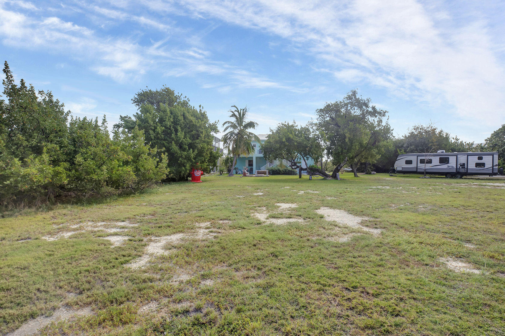 1632 Bogie Drive Big Pine Key, FL 33043 - Photo 36 of 47 a view of a field of grass and trees