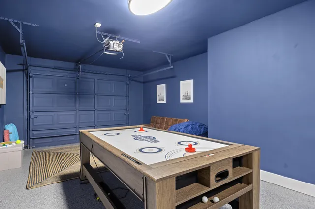 a utility room with a table and chairs
