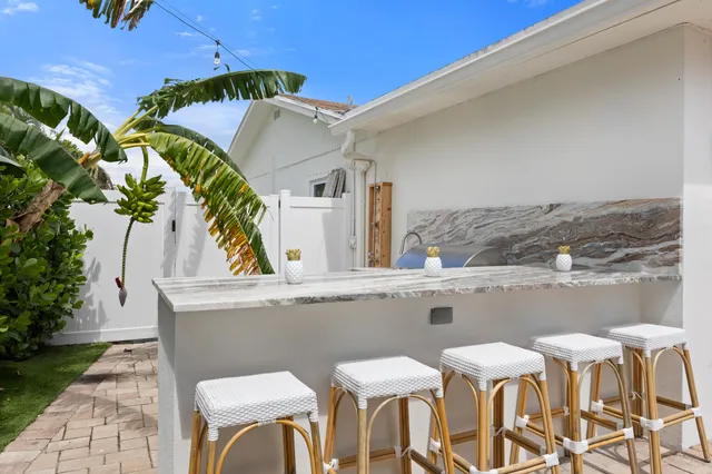 a view of a chairs and table in a patio