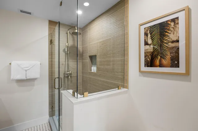 a bathroom with a shower and a sink