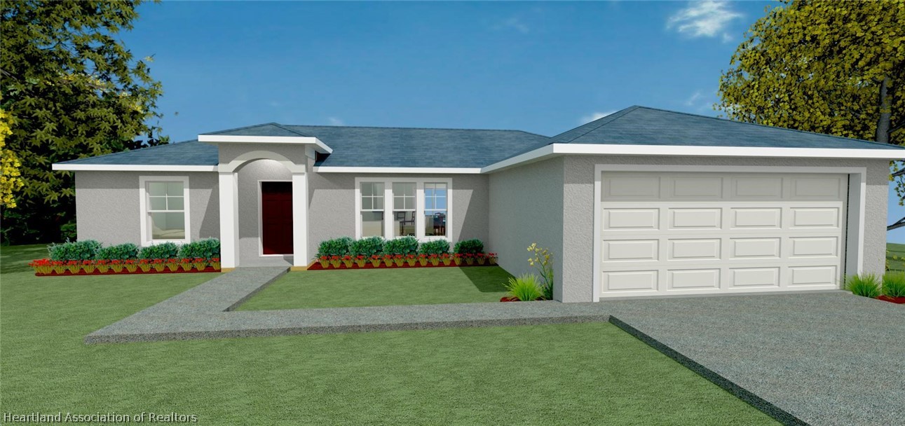 144 Lincoln Road Northwest Lake Placid, FL 33852 - Photo 19 of 19 a front view of a house with a yard