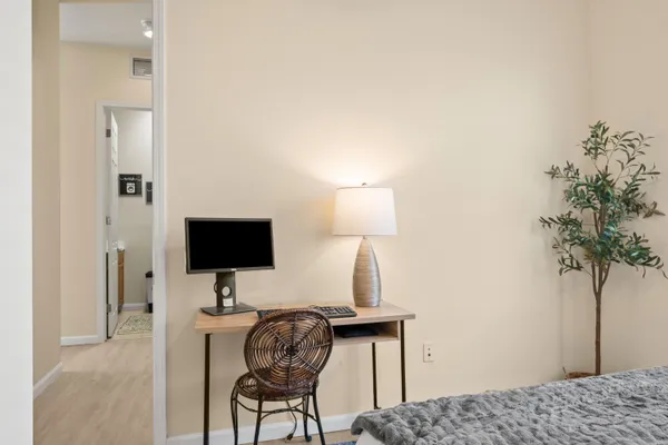 a view of a workspace with furniture