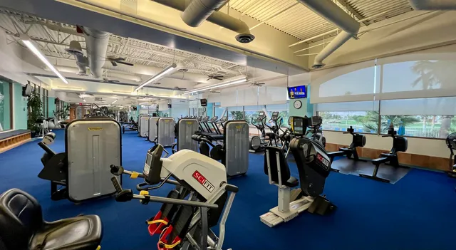 a room with gym equipment and a large window