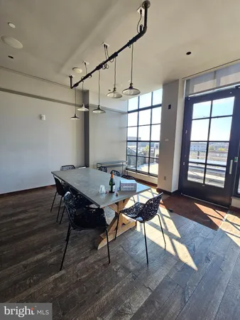 a workspace with furniture window and wooden floor