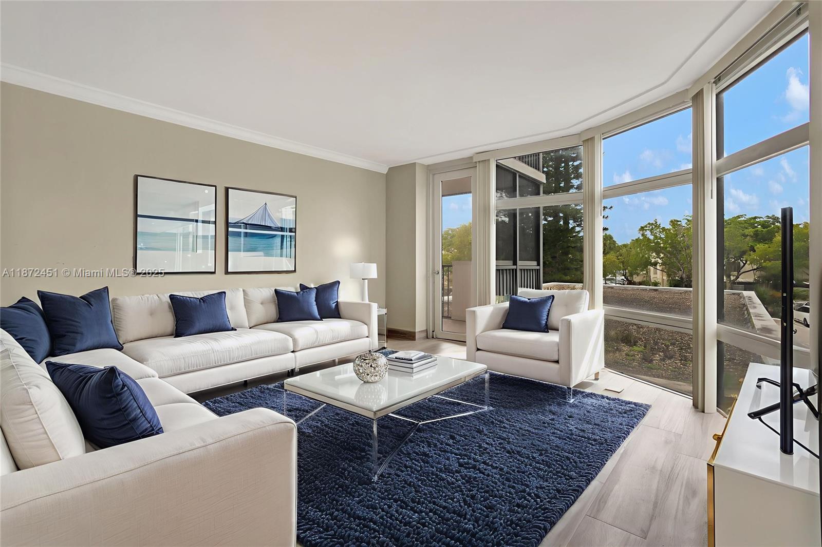 20100 West Country Club Drive, Unit 204 Aventura, FL 33180 - Photo 12 of 25 a living room with furniture and a rug