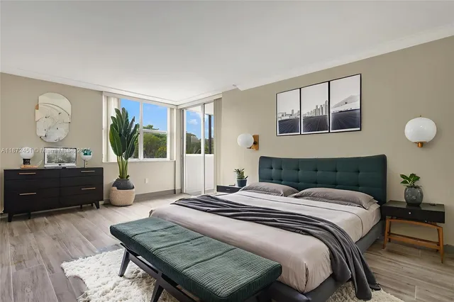 a bedroom with a bed window and a table