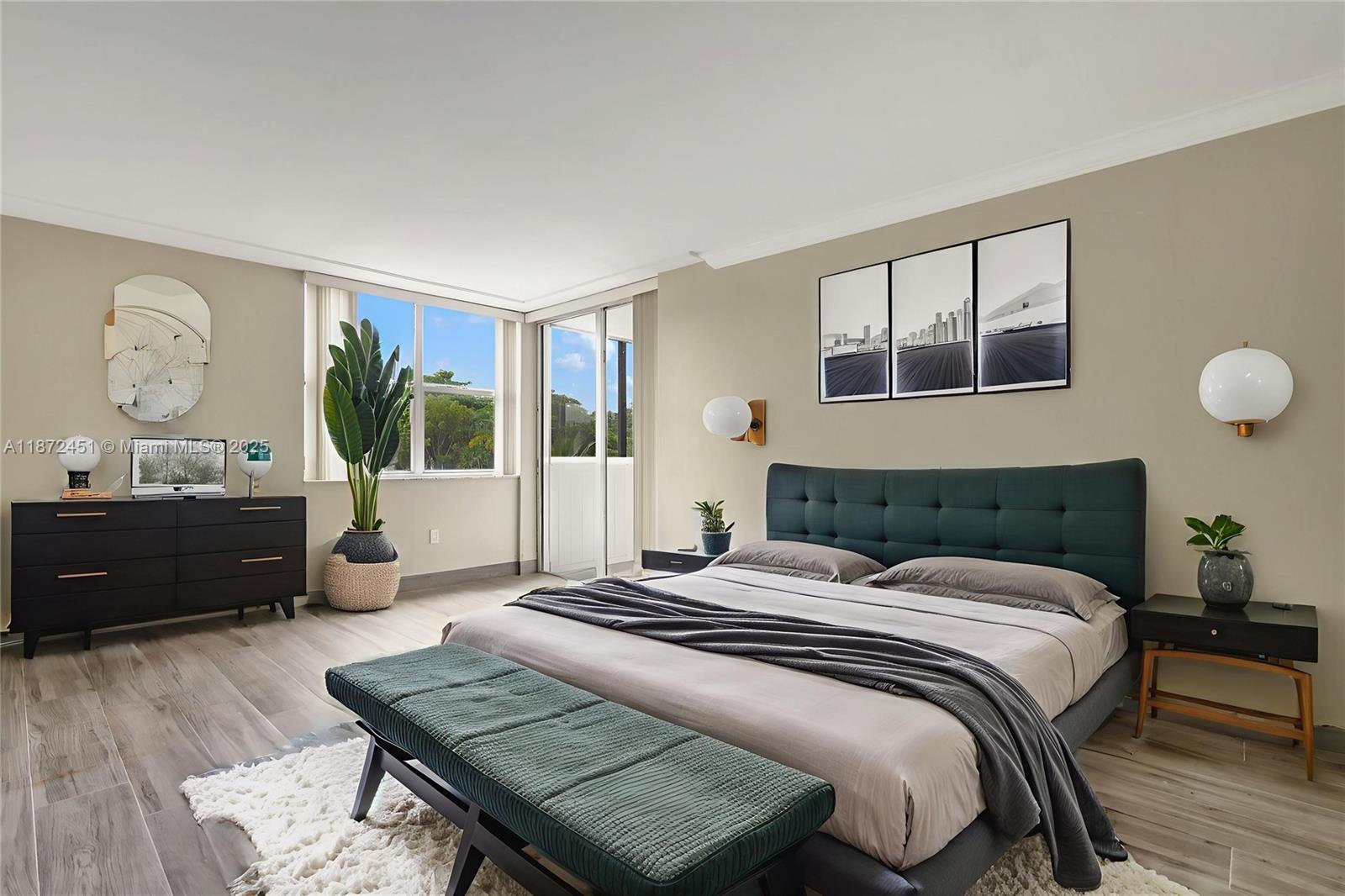 20100 West Country Club Drive, Unit 204 Aventura, FL 33180 - Photo 15 of 25 a bedroom with a bed window and a table