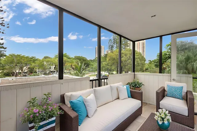 a aerial view of a house with garden space and sitting area