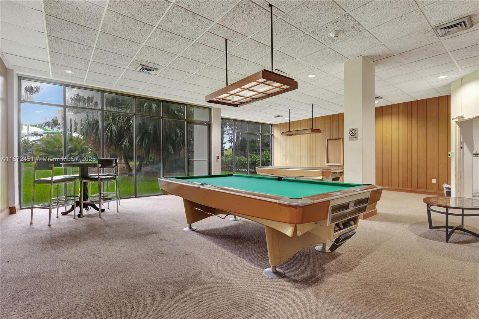 20100 West Country Club Drive, Unit 204 Aventura, FL 33180 - Photo 25 of 25 a park with large pool and outdoor seating