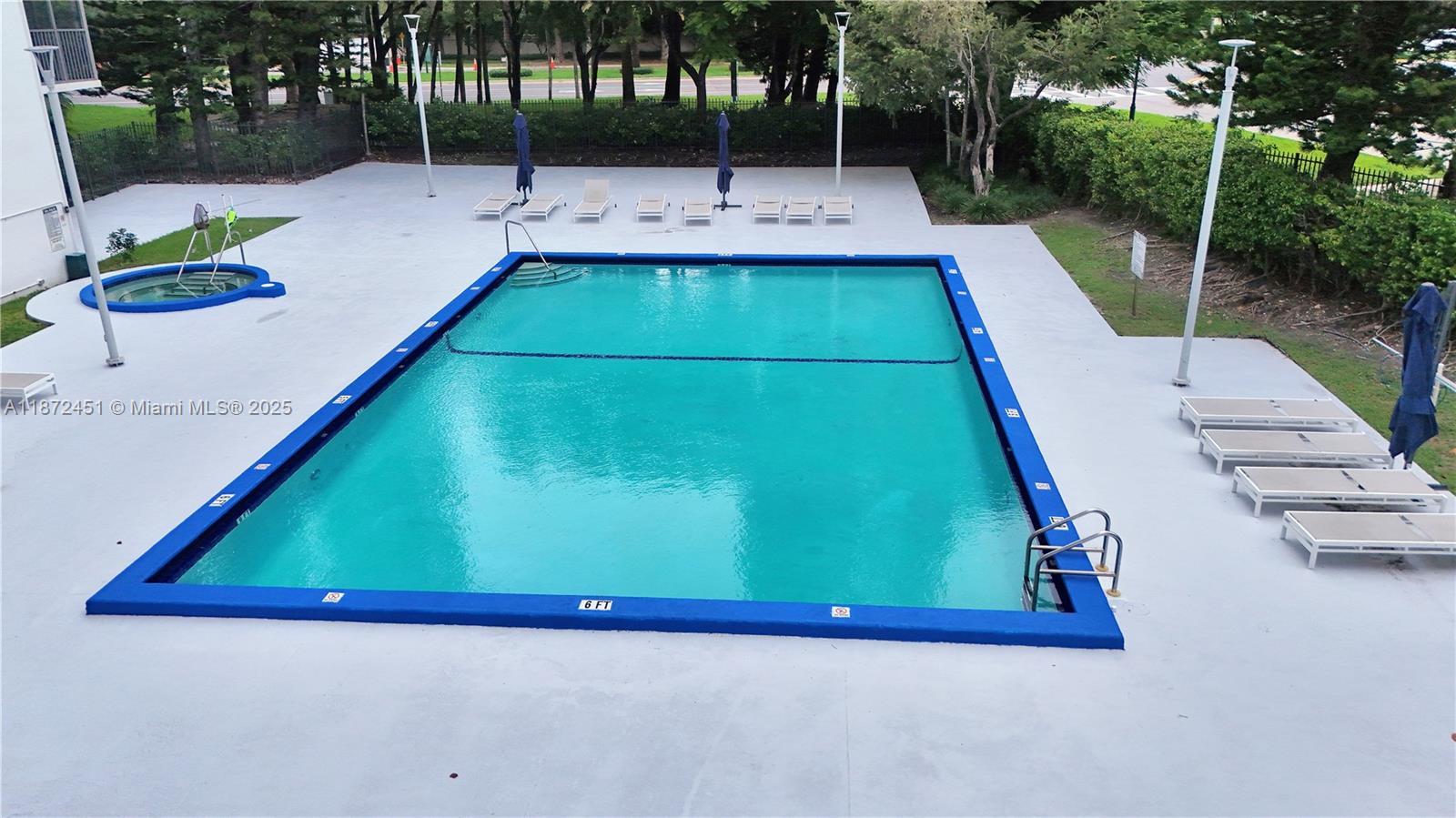 20100 West Country Club Drive, Unit 204 Aventura, FL 33180 - Photo 9 of 25 swimming pool view with a outdoor seating