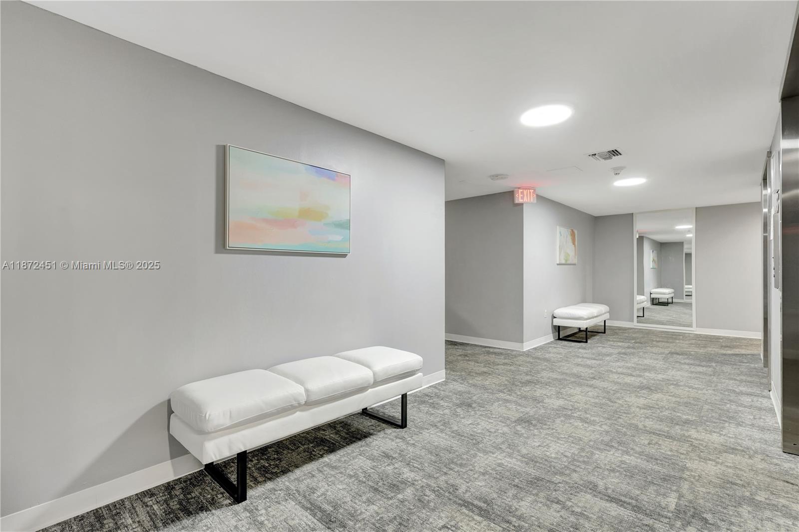 20100 West Country Club Drive, Unit 204 Aventura, FL 33180 - Photo 10 of 25 a living room with furniture and a rug