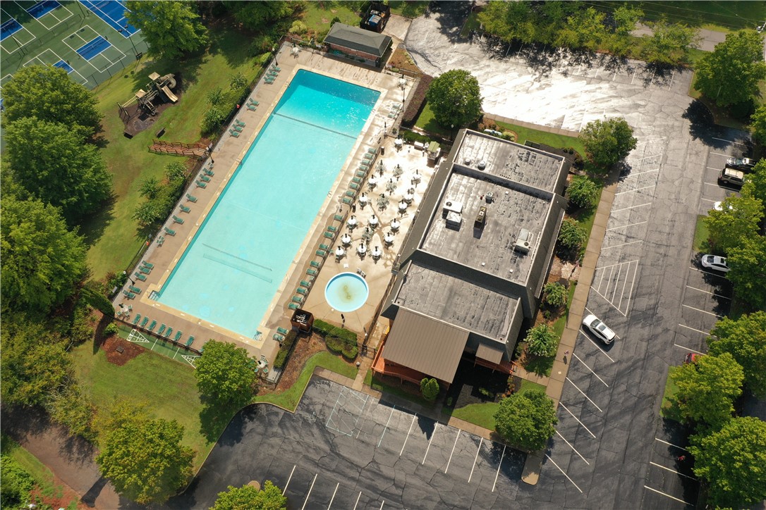 129 Middleton Drive Westminster, SC 29693 - Photo 4 of 12 An aerial view showcases the vibrant community amenities, including a refreshing pool and ample parking.