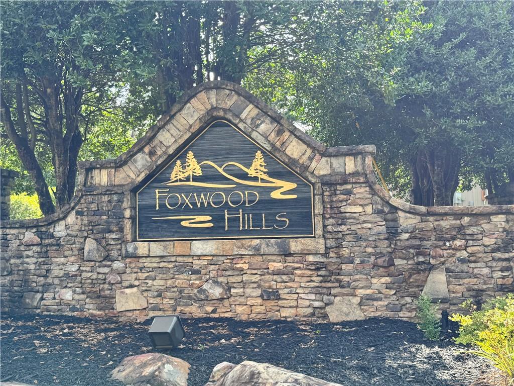 129 Middleton Drive Westminster, SC 29693 - Photo 6 of 12 Welcome home to this inviting entrance, featuring a well-crafted stone and wood sign.