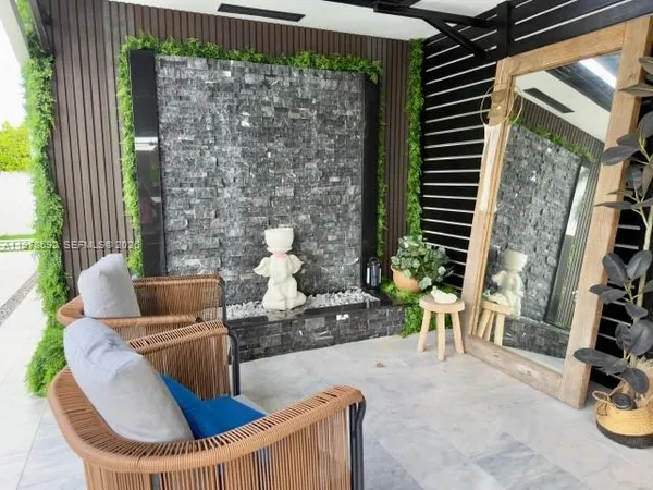 a living room with furniture and a window